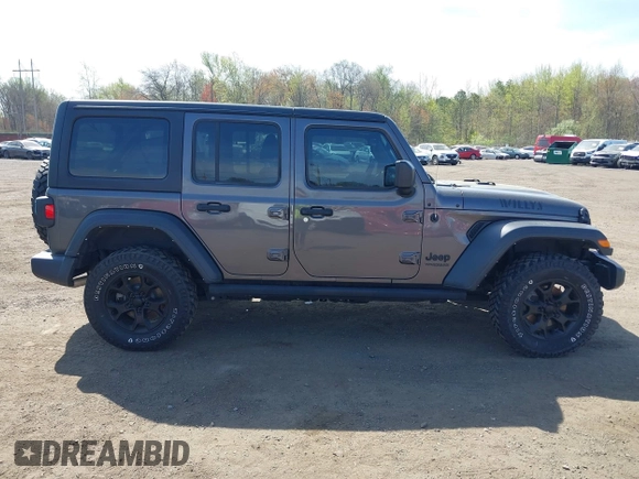 2021 Jeep Wrangler Unlimited Willys with VIN 1C4HJXDG1MW672507, listed as a IAAI auction lot 42084805 with 59,943 mi miles and . Bid and sale history available at DreamBid. Image 13.