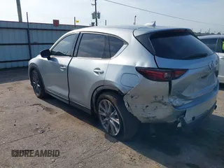 2020 Mazda CX-5 Grand Touring with VIN JM3KFADM5L0739306, listed as a IAAI auction lot 42215667 with 126,100 mi miles and . Bid and sale history available at DreamBid. Image 3.