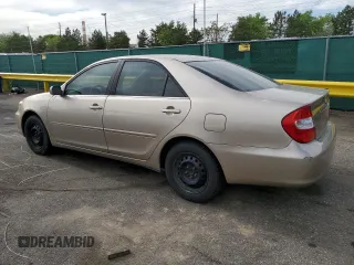 2002 Toyota Camry LE z VIN 4T1BE32K92U524457, wystawiony jako Copart lot #56864365 z przebiegiem 274 760 mil mil oraz Czysty tytuł • Clean title. Historia ofert i sprzedaży dostępna na DreamBid. Obrazek 2.