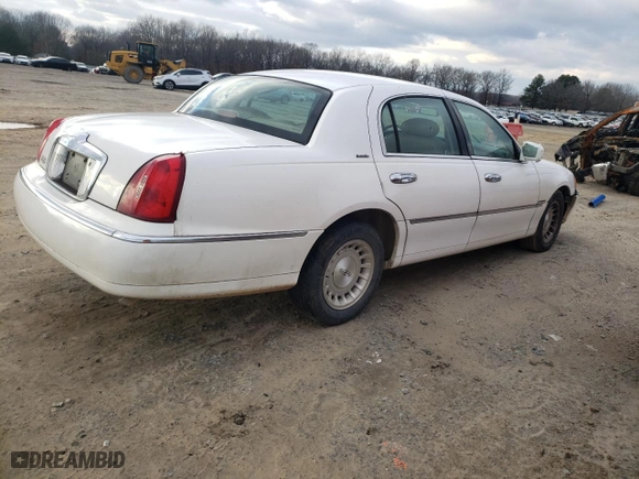1998 Lincoln Town Car Executive with VIN 1LNFM81W7WY661143, listed as a Copart auction lot 43244755 with 115,992 mi miles and Salvage Title. Bid and sale history available at carsss.com. Image 3.