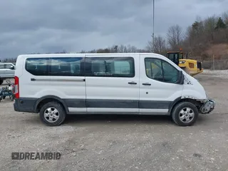 2019 Ford Transit Passenger XL with VIN 1FBZX2YM8KKA31871, listed as a IAAI auction lot 41168344 with 95,957 mi miles and . Bid and sale history available at DreamBid. Image 14.