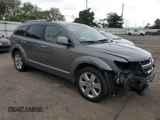 2012 Dodge Journey Crew with VIN 3C4PDDDG6CT275610, listed as a Copart auction lot 57063865 with 126,319 mi miles and Salvage title. Bid and sale history available at DreamBid. Image 4.