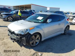 2013 Hyundai Veloster Turbo with VIN KMHTC6AE6DU162372, listed as a IAAI auction lot 41481820 with 105,650 mi miles and . Bid and sale history available at DreamBid. Image 2.