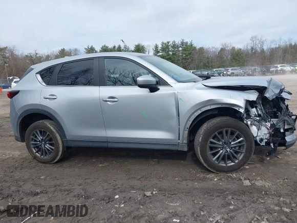 2021 Mazda CX-5 Touring with VIN JM3KFBCM9M1329806, listed as a IAAI auction lot 41825123 with 59,300 mi miles. Bid and sale history available at carsss.com. Image 13.