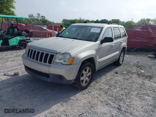 2010 Jeep Grand Cherokee Laredo with VIN 1J4PS4GK6AC136702, listed as a IAAI auction lot 42066484 with 126,509 mi miles. Bid and sale history available at carsss.com. Image 2.