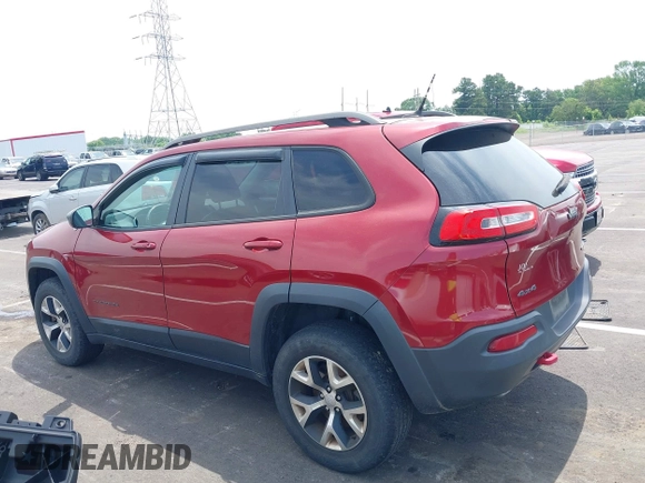 2014 Jeep Cherokee Trailhawk with VIN 1C4PJMBS7EW162357, listed as a IAAI auction lot 42601903 with 104,768 mi miles and . Bid and sale history available at DreamBid. Image 14.