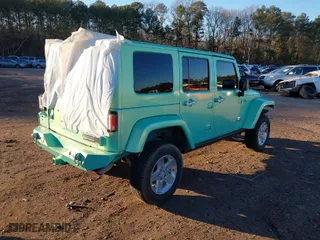 2010 Jeep Wrangler Unlimited Sport with VIN 1J4BA3H15AL166397, listed as a IAAI auction lot 41391376 with 87,091 mi miles. Bid and sale history available at carsss.com. Image 4.