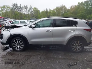 2018 Kia Sportage EX z VIN KNDPNCAC8J7309766, wystawiony jako IAAI lot #42219243 z przebiegiem 90 745 mil mil oraz . Historia ofert i sprzedaży dostępna na DreamBid. Obrazek 14.