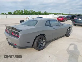 2017 Dodge Challenger R/T with VIN 2C3CDZBT8HH666130, listed as a IAAI auction lot 42173702 with 94,857 mi miles and . Bid and sale history available at DreamBid. Image 4.
