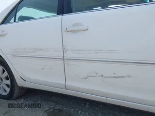 2002 Toyota Camry XLE z VIN 4T1BF30K22U007310, wystawiony jako IAAI lot #42419765 z przebiegiem 206 050 mil mil oraz . Historia ofert i sprzedaży dostępna na DreamBid. Obrazek 6.