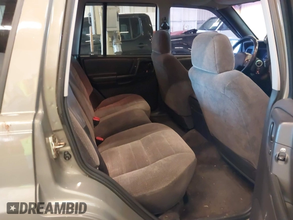 1996 Jeep Grand Cherokee Laredo with VIN 1J4GZ58S9TC293787, listed as a IAAI auction lot 41179368 with 141,755 mi miles. Bid and sale history available at carsss.com. Image 8.
