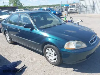 1997 Honda Civic LX with VIN JHMEJ6678VS032473, listed as a IAAI auction lot 42110249 with 257,328 mi miles. Bid and sale history available at carsss.com. Image 1.