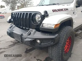 2021 Jeep Gladiator Willys with VIN 1C6HJTAG1ML572638, listed as a IAAI auction lot 42065562 with 43,040 mi miles and . Bid and sale history available at DreamBid. Image 6.