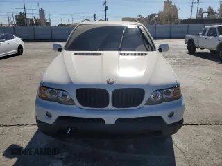 2006 BMW X5 3.0i with VIN 5UXFA135X6LY28695, listed as a Copart auction lot 77018914 with 209,013 mi miles and Salvage Title. Bid and sale history available at carsss.com. Image 5.