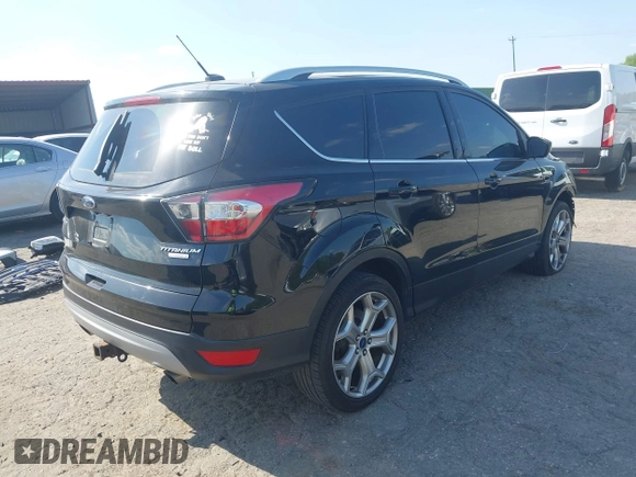 2017 Ford Escape Titanium with VIN 1FMCU0J91HUA75417, listed as a IAAI auction lot 42044170 with 116,431 mi miles. Bid and sale history available at carsss.com. Image 4.