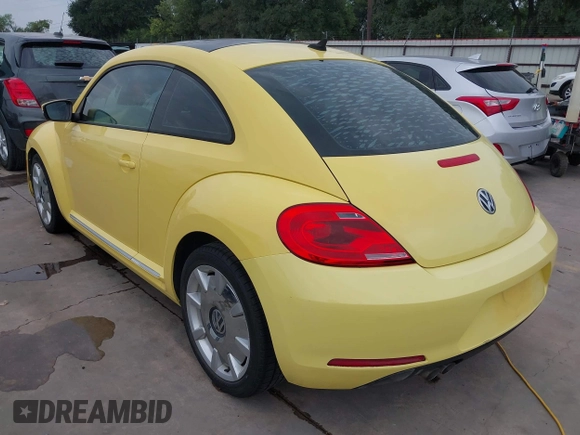 2013 Volkswagen Beetle 2.5L with VIN 3VWHX7AT7DM604449, listed as a IAAI auction lot 42406666 with 104,874 mi miles and . Bid and sale history available at DreamBid. Image 3.