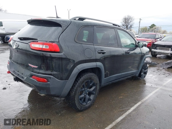 2016 Jeep Cherokee Trailhawk with VIN 1C4PJMBS5GW304062, listed as a IAAI auction lot 41756813 with 112,671 mi miles. Bid and sale history available at carsss.com. Image 4.