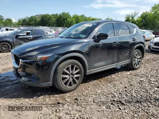 2018 Mazda CX-5 Grand Touring with VIN JM3KFBDM6J0345848, listed as a Copart auction lot 61587865 with 107,193 mi miles and Salvage title. Bid and sale history available at DreamBid. Image 1.