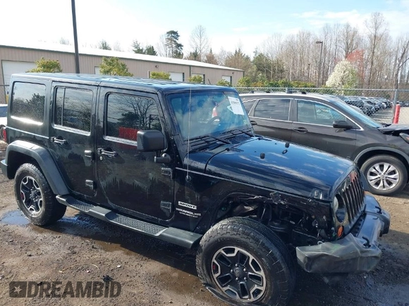 2013 Jeep Wrangler Unlimited Freedom z VIN 1C4BJWDG8DL648870, wystawiony jako IAAI lot #41909372 z przebiegiem 184 203 mil mil oraz . Historia ofert i sprzedaży dostępna na DreamBid. Obrazek 1.