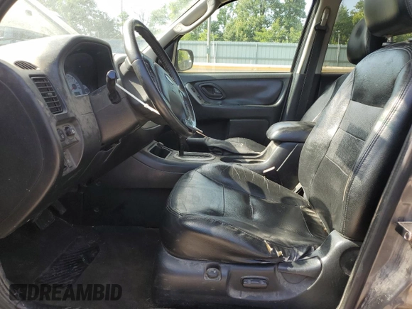 2005 Ford Escape Limited with VIN 1FMYU041X5KC72704, listed as a Copart auction lot 57819655 with 179,469 mi miles and Salvage title. Bid and sale history available at DreamBid. Image 7.