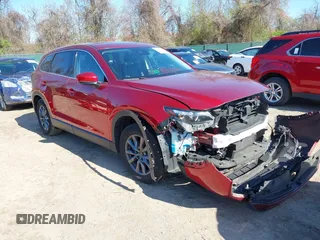 2020 Mazda CX-9 Touring z VIN JM3TCBCY6L0401324, wystawiony jako IAAI lot #41973626 z przebiegiem 53 891 mil mil oraz . Historia ofert i sprzedaży dostępna na DreamBid. Obrazek 1.