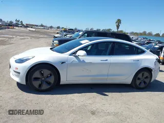 2019 Tesla Model 3 Mid Range with VIN 5YJ3E1EA1KF422983, listed as a IAAI auction lot 41861334 with 53,017 mi miles. Bid and sale history available at carsss.com. Image 14.