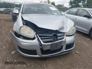 2007 Volkswagen Jetta Wolfsburg Edition z VIN 3VWEF71K77M166713, wystawiony jako IAAI lot #42746458 z przebiegiem 214 241 mil mil oraz . Historia ofert i sprzedaży dostępna na DreamBid. Obrazek 6.