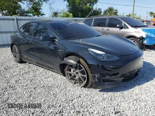 2022 Tesla Model 3 with VIN 5YJ3E1EA1NF374390, listed as a Copart auction lot 52709455 with 44,212 mi miles and Non Repairable. Bid and sale history available at carsss.com. Image 4.