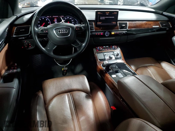 2011 Audi A8 z VIN WAURVAFD8BN005569, wystawiony jako Copart lot #52101065 z przebiegiem 104 893 mil mil oraz Szkody całkowita. Historia ofert i sprzedaży dostępna na DreamBid. Obrazek 8.