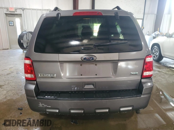 2012 Ford Escape XLT z VIN 1FMCU9DG8CKA93402, wystawiony jako Copart lot #62266845 z przebiegiem 196 779 mil mil oraz Szkoda całkowita • Salvage title. Historia ofert i sprzedaży dostępna na DreamBid. Obrazek 6.
