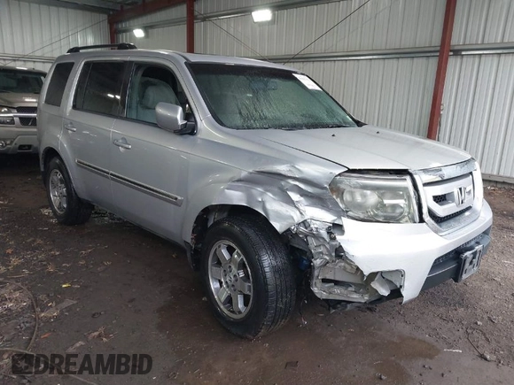 2011 Honda Pilot Touring with VIN 5FNYF4H90BB084692, listed as a IAAI auction lot 41867622 with 62,805 mi miles. Bid and sale history available at carsss.com. Image 1.