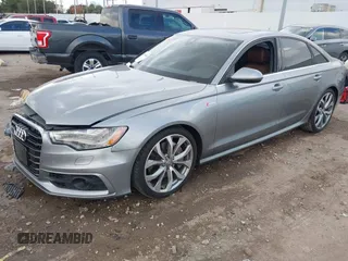 2013 Audi A6 3.0T Prestige with VIN WAUHGAFC3DN131239, listed as a IAAI auction lot 41168869 with 134,628 mi miles. Bid and sale history available at carsss.com. Image 2.