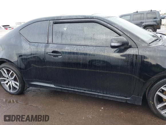 2015 Scion tC with VIN JTKJF5C79FJ003404, listed as a IAAI auction lot 41756024 with 128,906 mi miles. Bid and sale history available at carsss.com. Image 13.