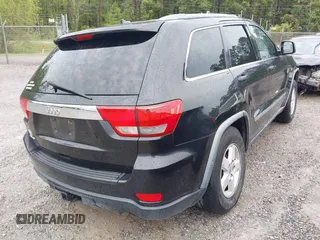 2011 Jeep Grand Cherokee Laredo with VIN 1J4RS4GG7BC569287, listed as a IAAI auction lot 41915092 with 211,148 mi miles and . Bid and sale history available at DreamBid. Image 4.