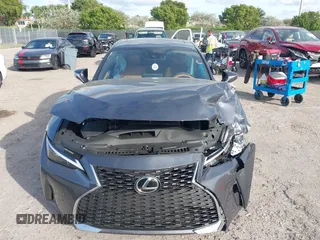 2024 Lexus IS with VIN JTHCA1D24R5131782, listed as a IAAI auction lot 41195539 with 4,104 mi miles. Bid and sale history available at carsss.com. Image 12.