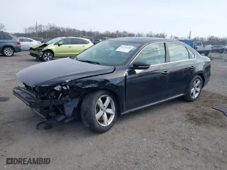 2012 Volkswagen Passat SE with VIN 1VWBP7A37CC021336, listed as a IAAI auction lot 41724459 with 124,832 mi miles. Bid and sale history available at carsss.com. Image 2.