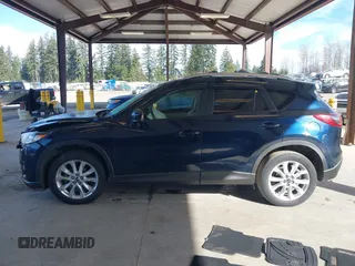 2014 Mazda CX-5 Grand Touring with VIN JM3KE2DY6E0394172, listed as a IAAI auction lot 41698468 with 89,554 mi miles. Bid and sale history available at carsss.com. Image 14.