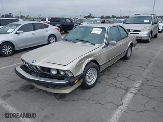1985 BMW 6 Series 635CSi with VIN WBAEC8400F0610637, listed as a IAAI auction lot 41935412 with 129,943 mi miles. Bid and sale history available at carsss.com. Image 2.