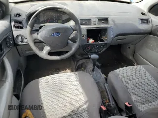 2007 Ford Focus S with VIN 1FAFP34N67W101523, listed as a Copart auction lot 56521835 with 239,505 mi miles and Salvage title. Bid and sale history available at DreamBid. Image 8.