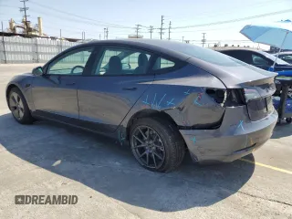 2023 Tesla Model 3 with VIN 5YJ3E1EA3PF695267, listed as a Copart auction lot 52559645 with 9,025 mi miles and Salvage title. Bid and sale history available at DreamBid. Image 2.