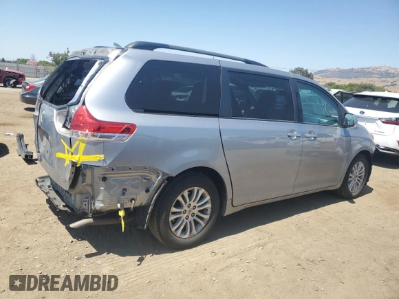 2012 Toyota Sienna XLE AAS with VIN 5TDYK3DC1CS204598, listed as a Copart auction lot 62293015 with 76,108 mi miles and Salvage title. Bid and sale history available at DreamBid. Image 3.