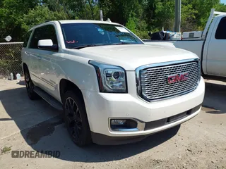 2015 GMC Yukon Denali with VIN 1GKS1CKJ8FR575730, listed as a IAAI auction lot 42048050 with 113,077 mi miles. Bid and sale history available at carsss.com. Image 1.