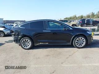 2017 Tesla Model X 90D with VIN 5YJXCBE25HF044617, listed as a IAAI auction lot 42096323 with 115,077 mi miles and . Bid and sale history available at DreamBid. Image 14.