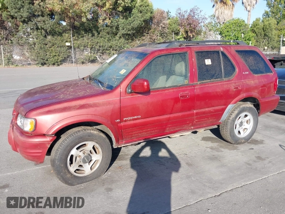 2001 Isuzu Rodeo S with VIN 4S2DM58W814303358, listed as a IAAI auction lot 42695509 with Not provided miles and . Bid and sale history available at DreamBid. Image 6.