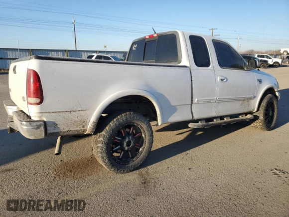 2000 Ford F-150 XL with VIN 1FTRX18L3YKA09007, listed as a Copart auction lot 42828005 with 218,563 mi miles and Salvage Title. Bid and sale history available at carsss.com. Image 3.