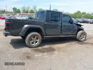 2021 Jeep Gladiator Freedom with VIN 1C6HJTAG3ML557932, listed as a IAAI auction lot 42150245 with 26,656 mi miles and . Bid and sale history available at DreamBid. Image 4.