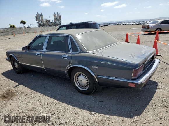 1992 Jaguar XJ with VIN SAJHY174XNC649368, listed as a Copart auction lot 50191454 with 99,553 mi miles and Salvage Title. Bid and sale history available at DreamBid. Image 2.