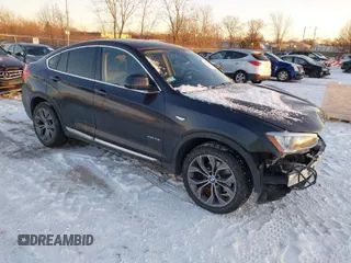 2015 BMW X4 xDrive28i with VIN 5UXXW3C5XF0M88838, listed as a IAAI auction lot 41313270 with 84,321 mi miles. Bid and sale history available at carsss.com. Image 1.