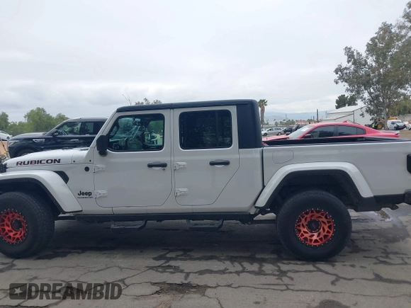 2021 Jeep Gladiator Willys with VIN 1C6HJTAG1ML572638, listed as a IAAI auction lot 42065562 with 43,040 mi miles and . Bid and sale history available at DreamBid. Image 14.