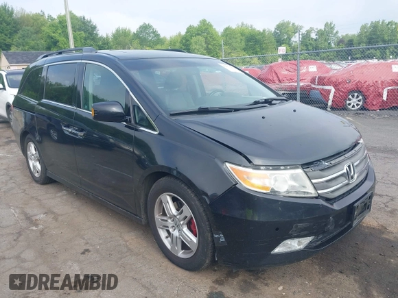2011 Honda Odyssey Touring with VIN 5FNRL5H93BB104906, listed as a IAAI auction lot 42371279 with 183,856 mi miles and . Bid and sale history available at DreamBid. Image 1.